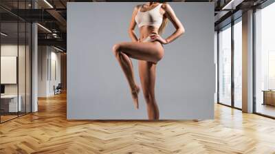 Full height woman with perfect body in underwear isolated over gray background Wall mural